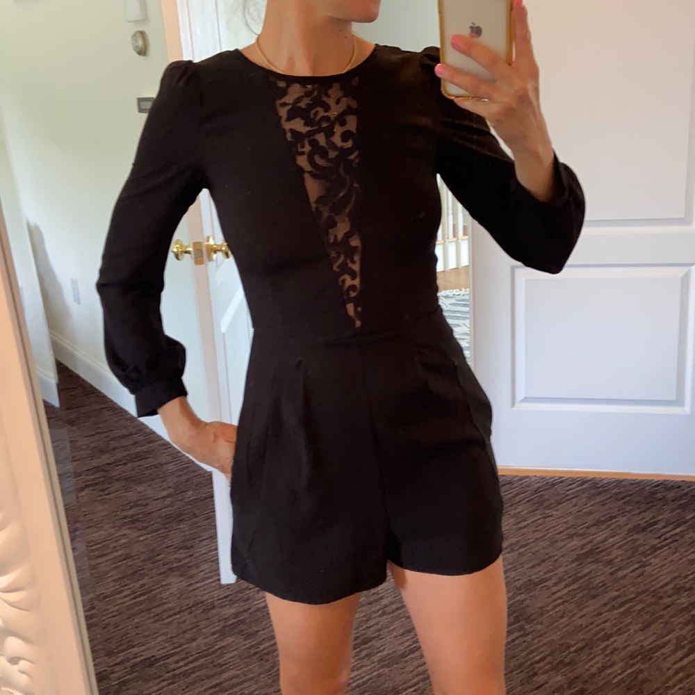 Fitting black romper with pockets, very flattering.